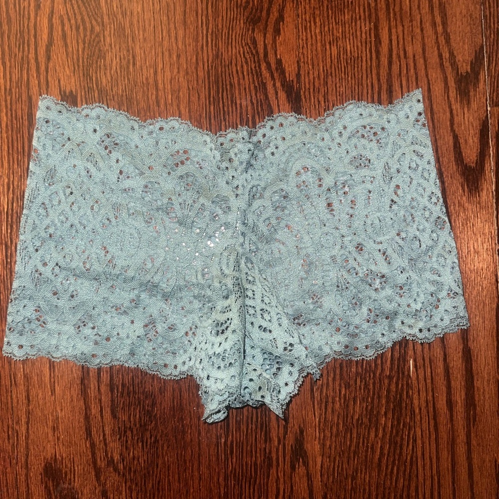 Delicate Lace in Light Blue. Never worn New